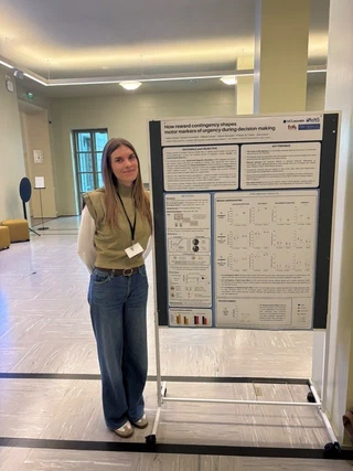 Fostine presenting her research poster in Helsinki