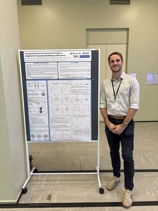 Thibault presenting his research poster in Helsinki